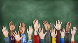 hands raised chalkboard