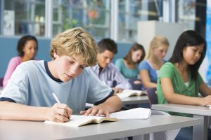 Schoolboy in high school class