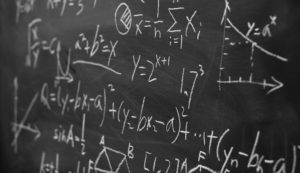 Maths formulas on chalkboard background